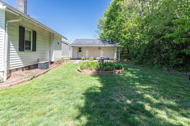 508 Meadow St, North Union Twp, PA 15401 - view of green lawn featuring an outdoor structure and central air condition unit