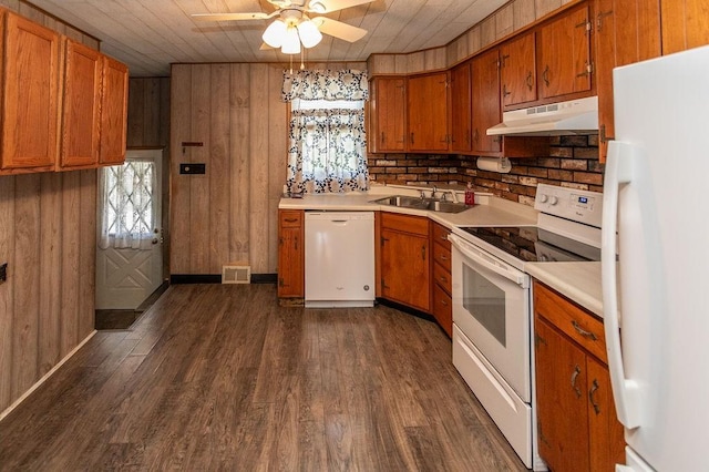 508 Meadow St, North Union Twp, PA 15401 - kitchen with white appliances, under cabinet range hood, a ceiling fan, brown cabinets, and wood walls