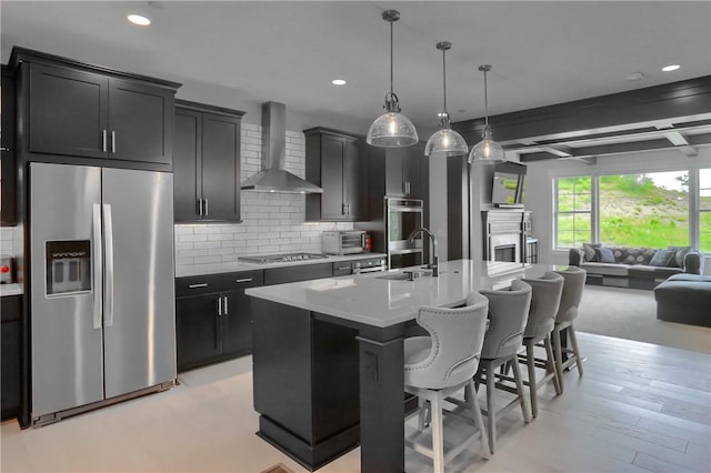 302 Highpointe Dr, Seven Fields Boro, PA 16046 - kitchen with appliances with stainless steel finishes, wall chimney exhaust hood, open floor plan, a breakfast bar area, and decorative backsplash