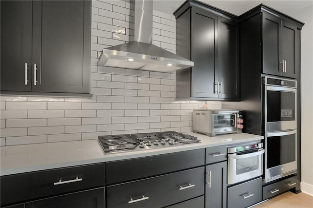 302 Highpointe Dr, Seven Fields Boro, PA 16046 - kitchen with wall chimney range hood, appliances with stainless steel finishes, backsplash, light countertops, and dark cabinets