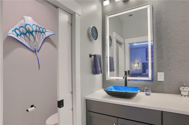302 Highpointe Dr, Seven Fields Boro, PA 16046 - bathroom featuring vanity and decorative backsplash