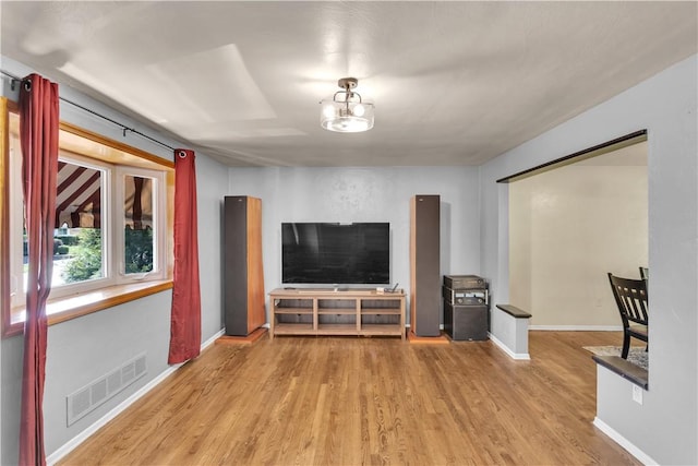 2389 High Oak Dr, Banksville/Westwood, PA 15220 - living room with wood finished floors, baseboards, and a chandelier