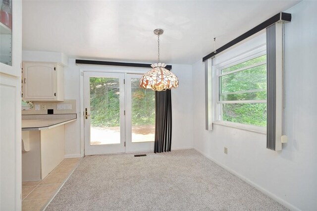 504 N St, Baldwin Boro, PA 15227 - unfurnished dining area with plenty of natural light, a chandelier, light carpet, and baseboards