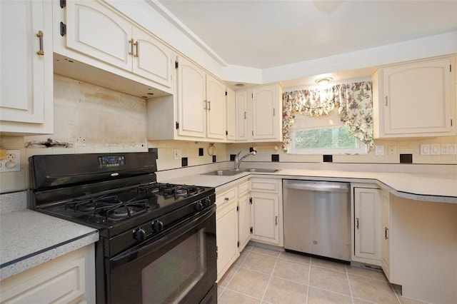 504 N St, Baldwin Boro, PA 15227 - kitchen with dishwasher, black range with gas cooktop, a sink, light tile patterned flooring, and light countertops