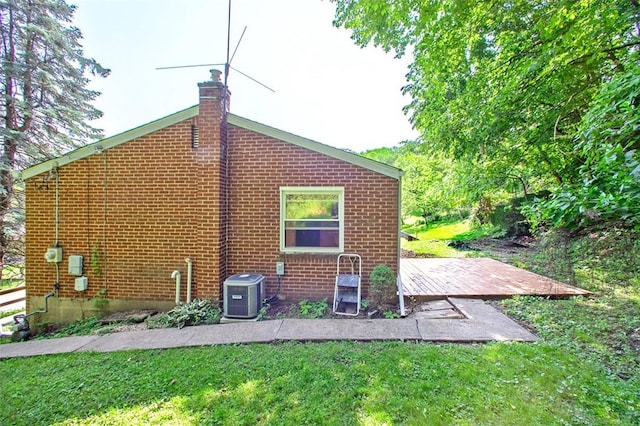 504 N St, Baldwin Boro, PA 15227 - back of property with cooling unit, a chimney, a yard, and brick siding
