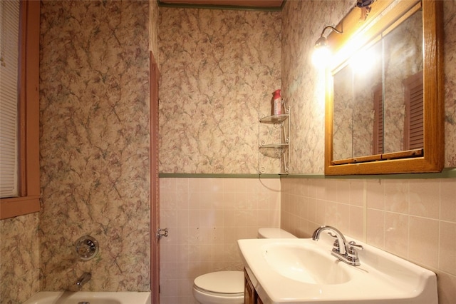 202 Jane St, Mckees Rocks, PA 15136 - full bath with toilet, wallpapered walls, a wainscoted wall, vanity, and tile walls