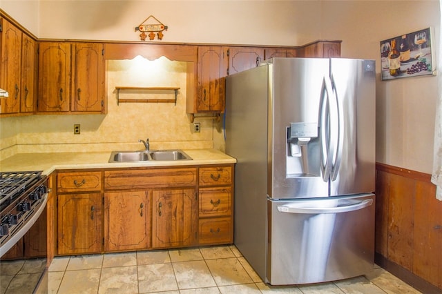 202 Jane St, Mckees Rocks, PA 15136 - kitchen with appliances with stainless steel finishes, a sink, brown cabinets, and light countertops