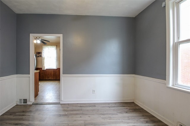 202 Jane St, Mckees Rocks, PA 15136 - empty room featuring wainscoting, wood finished floors, and a ceiling fan
