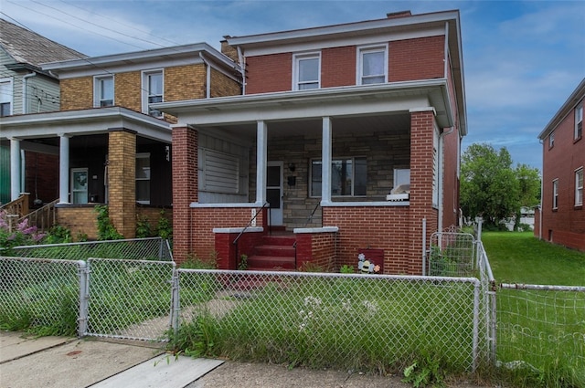 202 Jane St, Mckees Rocks, PA 15136 - american foursquare style home with brick siding, a porch, a gate, and a fenced front yard