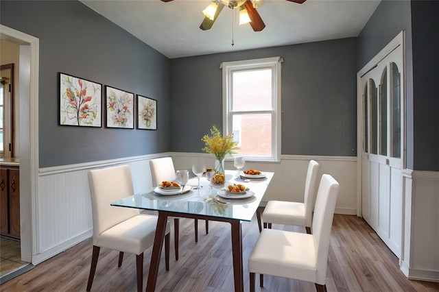 202 Jane St, Mckees Rocks, PA 15136 - dining space featuring a wainscoted wall, a ceiling fan, and wood finished floors