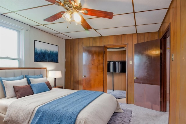 202 Jane St, Mckees Rocks, PA 15136 - carpeted bedroom featuring wood walls, a paneled ceiling, and ceiling fan