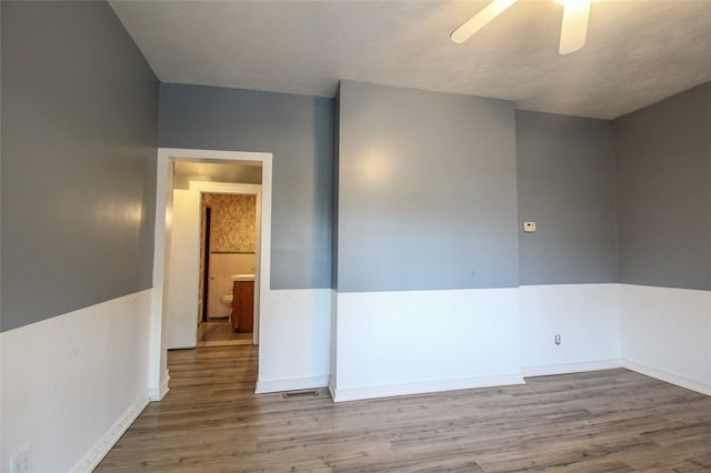202 Jane St, Mckees Rocks, PA 15136 - empty room featuring wood finished floors, a ceiling fan, and baseboards