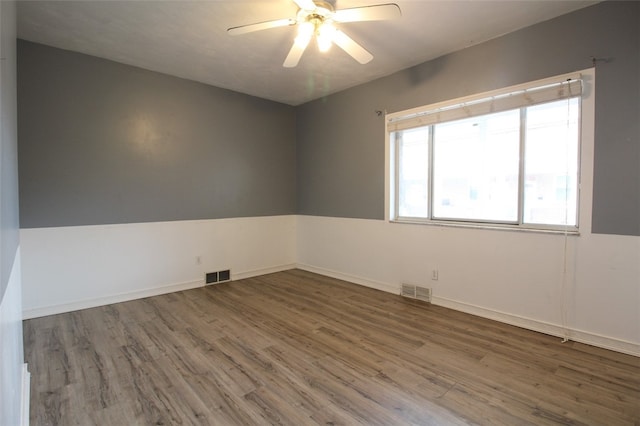 202 Jane St, Mckees Rocks, PA 15136 - spare room with wood finished floors, ceiling fan, and baseboards