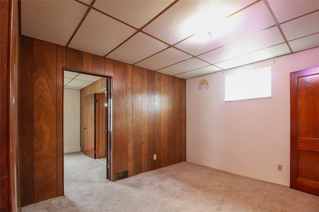 202 Jane St, Mckees Rocks, PA 15136 - carpeted empty room featuring wood walls and a paneled ceiling