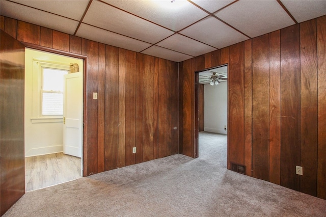 202 Jane St, Mckees Rocks, PA 15136 - spare room with carpet, wood walls, and a drop ceiling