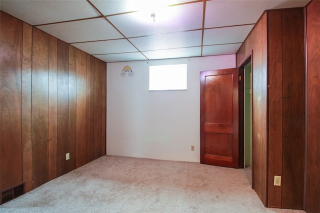 202 Jane St, Mckees Rocks, PA 15136 - carpeted empty room with wood walls and a paneled ceiling
