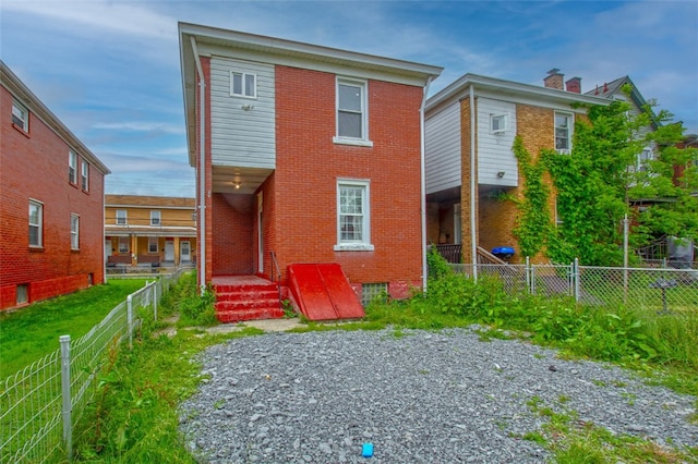 202 Jane St, Mckees Rocks, PA 15136 - view of front facade featuring brick siding and a fenced backyard