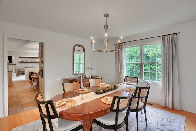 814 Graywyck Dr, Seven Fields Boro, PA 16046 - dining area with a chandelier and light wood finished floors