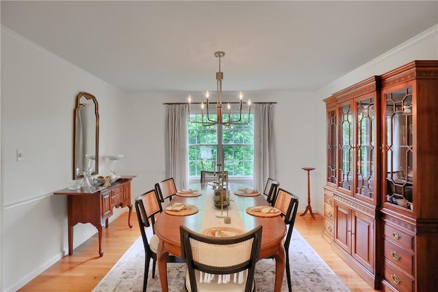 814 Graywyck Dr, Seven Fields Boro, PA 16046 - dining space featuring a chandelier, light wood-style flooring, and baseboards