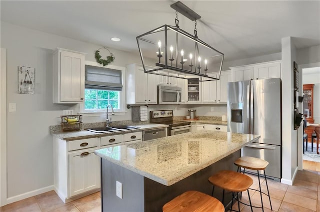 814 Graywyck Dr, Seven Fields Boro, PA 16046 - kitchen featuring stainless steel appliances, a sink, light tile patterned flooring, a breakfast bar area, and recessed lighting