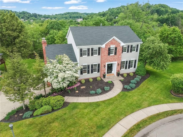 814 Graywyck Dr, Seven Fields Boro, PA 16046 - colonial inspired home with a shingled roof, a front lawn, a chimney, and a forest view
