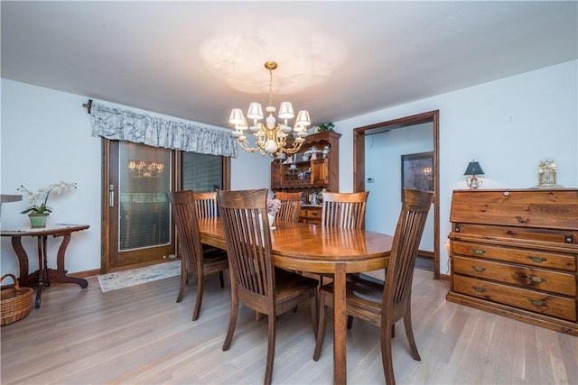 322 Franklin Dr, Peters Twp, PA 15241 - dining space with a chandelier, light wood finished floors, and baseboards