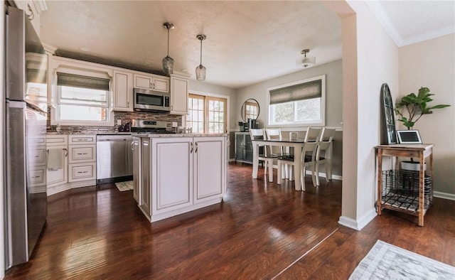 10 Claireview Dr, Carnegie, PA 15106 - kitchen with appliances with stainless steel finishes, dark wood-type flooring, decorative light fixtures, tasteful backsplash, and a kitchen island