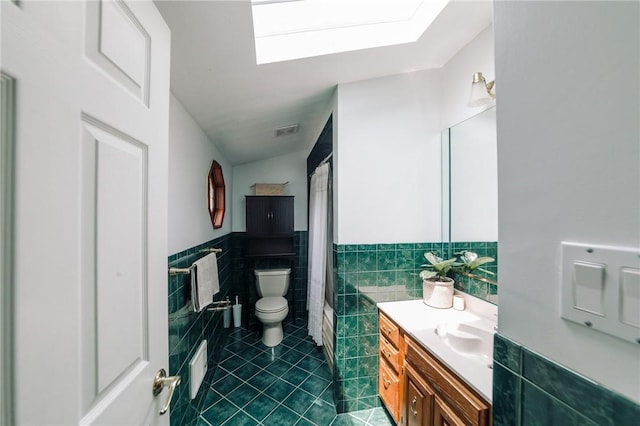 10 Claireview Dr, Scott Twp Sal, PA 15106 - bathroom featuring tile walls, vanity, tile patterned floors, toilet, and wainscoting