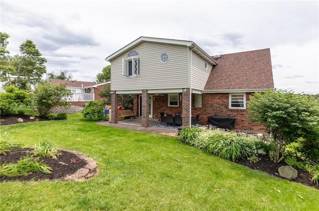 10 Claireview Dr, Carnegie, PA 15106 - back of house with a yard, brick siding, and a patio