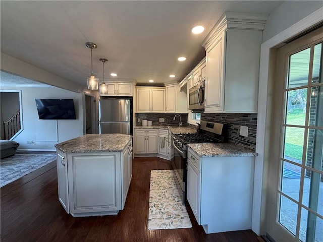 10 Claireview Dr, Carnegie, PA 15106 - kitchen featuring appliances with stainless steel finishes, a kitchen island, dark wood finished floors, white cabinetry, and recessed lighting