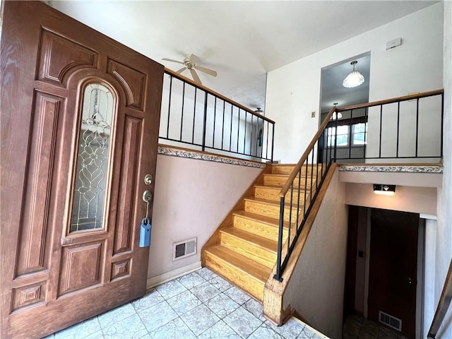 501 Clarendon St, Ohara, PA 15238 - foyer entrance featuring ceiling fan, stairway, and baseboards