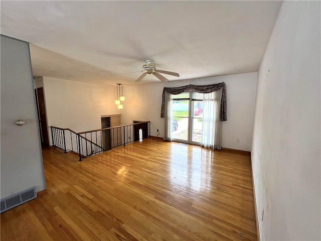 501 Clarendon St, Ohara, PA 15238 - spare room featuring wood finished floors, a ceiling fan, and baseboards