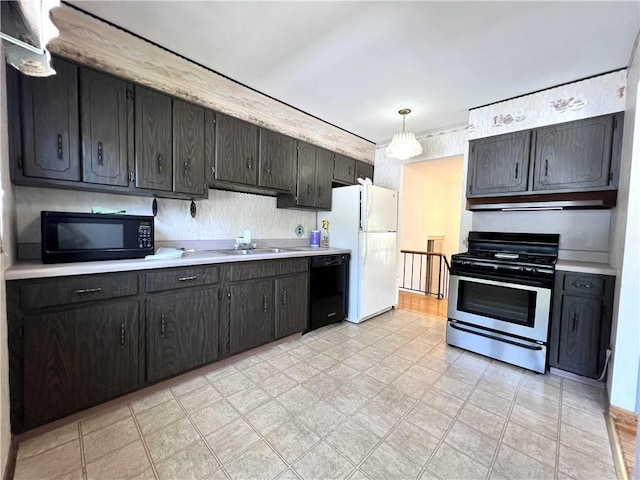 501 Clarendon St, Ohara, PA 15238 - kitchen featuring black appliances, light countertops, a sink, light flooring, and under cabinet range hood