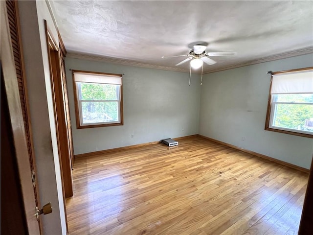 501 Clarendon St, Ohara, PA 15238 - empty room with light wood-type flooring, ceiling fan, crown molding, and baseboards