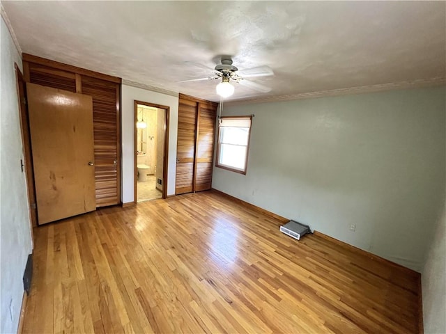 501 Clarendon St, Ohara, PA 15238 - unfurnished bedroom featuring light wood-style floors, ceiling fan, and connected bathroom