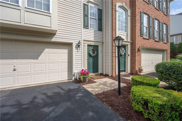 113 Unity Sq, Unity Twp, PA 15601 - entrance to property with an attached garage, brick siding, and driveway