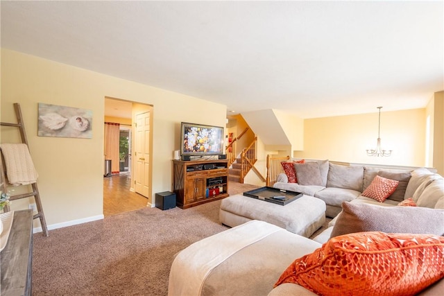 113 Unity Sq, Unity Twp, PA 15601 - carpeted living room with stairs, a chandelier, and baseboards