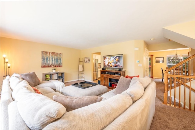 113 Unity Sq, Unity Twp, PA 15601 - living room with carpet, a chandelier, baseboards, and stairway