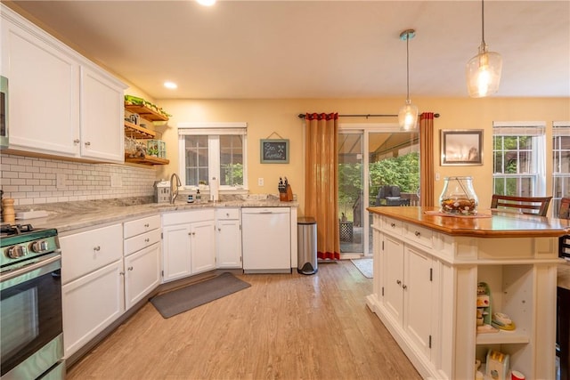 113 Unity Sq, Unity Twp, PA 15601 - kitchen featuring open shelves, appliances with stainless steel finishes, light wood-style flooring, white cabinetry, and a sink