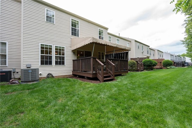 113 Unity Sq, Unity Twp, PA 15601 - back of house featuring central AC unit, a deck, and a lawn