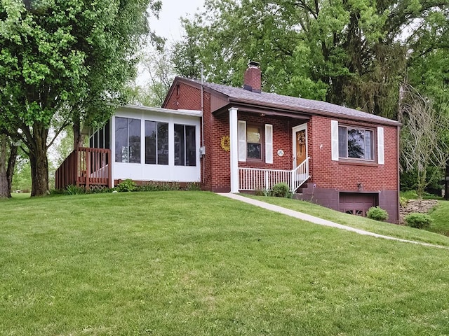 118 Judith Dr, Peters Twp, PA 15367 - ranch-style house featuring a chimney, a garage, a front yard, a sunroom, and brick siding