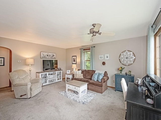 118 Judith Dr, Peters Twp, PA 15367 - living room with arched walkways, carpet floors, a ceiling fan, and baseboards