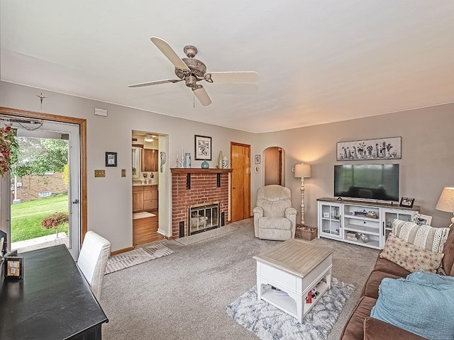 118 Judith Dr, Peters Twp, PA 15367 - living area featuring arched walkways, carpet flooring, a ceiling fan, a fireplace, and baseboards