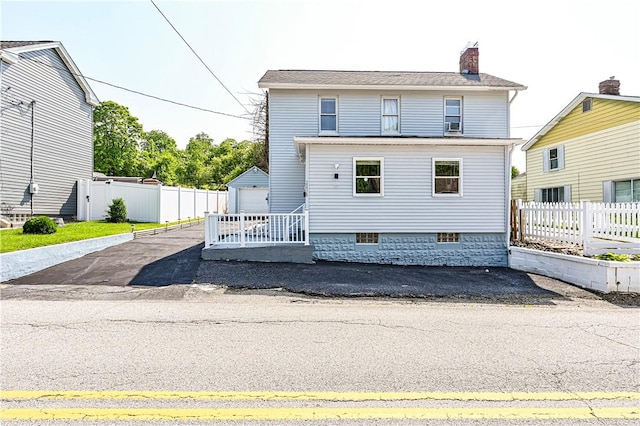 2216 Keystone Ave, Hempfield Twp Wml, PA 15601 - view of front of home featuring a chimney, an outdoor structure, and a detached garage