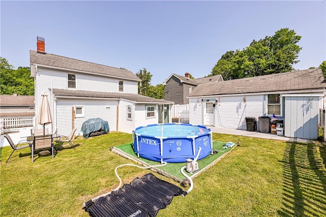 2216 Keystone Ave, Hempfield Twp Wml, PA 15601 - back of house featuring an outbuilding and a chimney