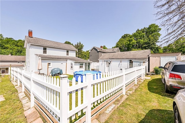 2216 Keystone Ave, Hempfield Twp Wml, PA 15601 - rear view of house featuring a chimney