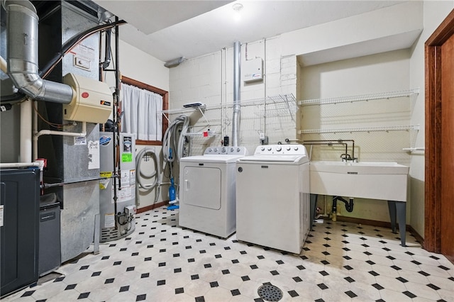 120 Canterbury Ln, Peters Twp, PA 15317 - washroom with washing machine and clothes dryer, light flooring, gas water heater, and concrete block wall