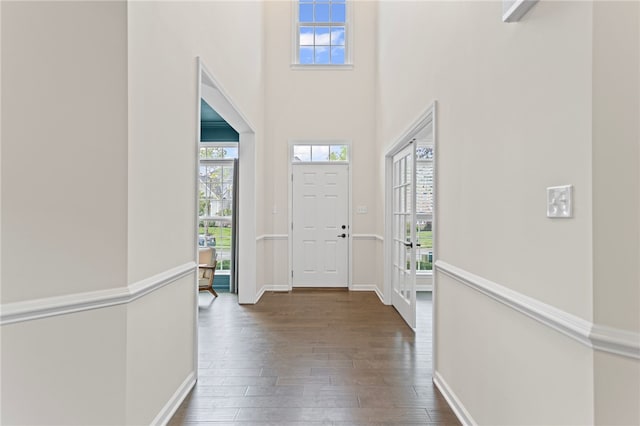 3035 Brookstone Dr, Cecil, PA 15317 - foyer entrance with healthy amount of natural light, dark wood-type flooring, a towering ceiling, and baseboards