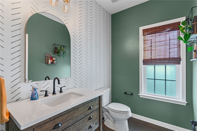 3035 Brookstone Dr, Cecil, PA 15317 - bathroom featuring vanity, wood finished floors, toilet, and baseboards
