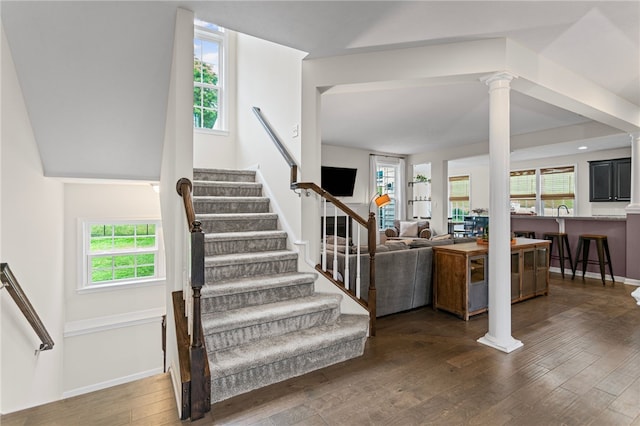 3035 Brookstone Dr, Cecil, PA 15317 - stairway featuring wood finished floors, healthy amount of natural light, and decorative columns